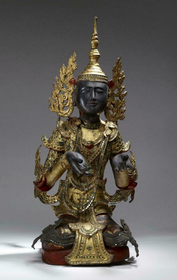 Antique gilded statue with intricate gold decorations, an interesting strange artifact discovery