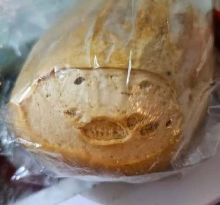 Packaged bread with markings resembling a smiling face