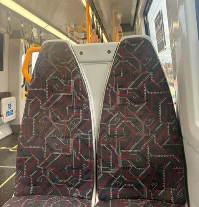 Bus seats patterned with designs that look like staring faces