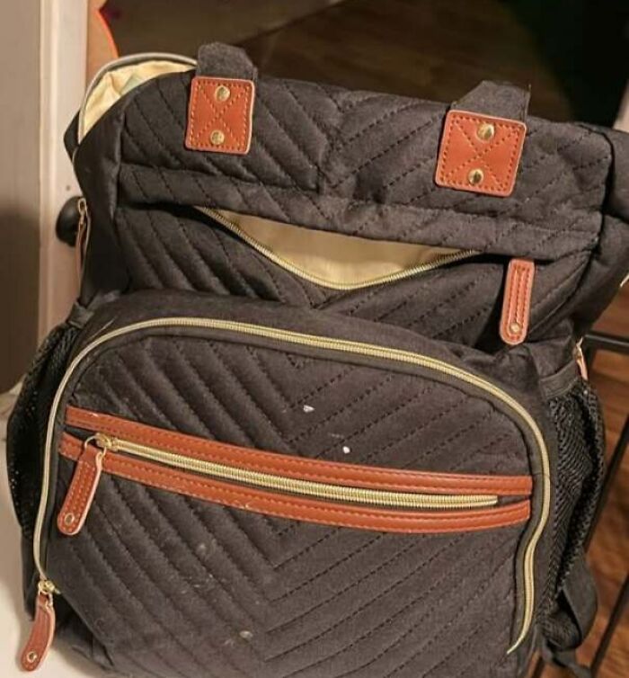 Backpack zipper resembling a smiling face