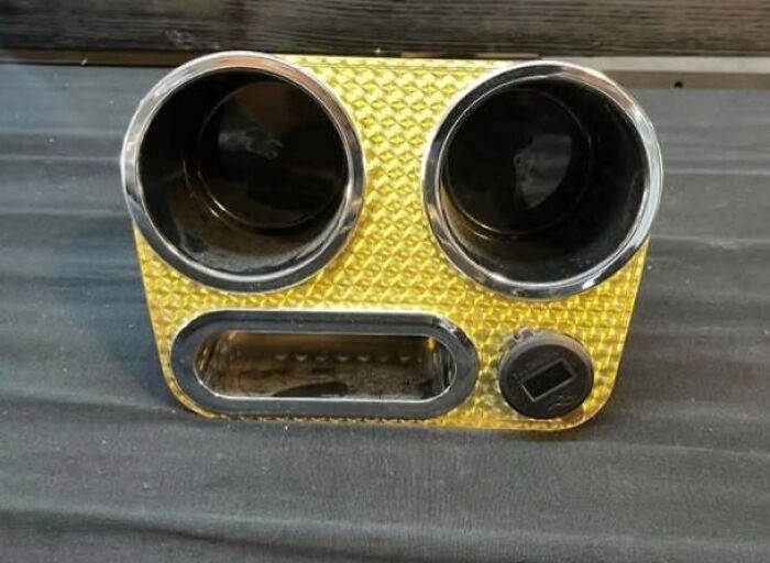 Car cup holder and ashtray combo resembling a staring face