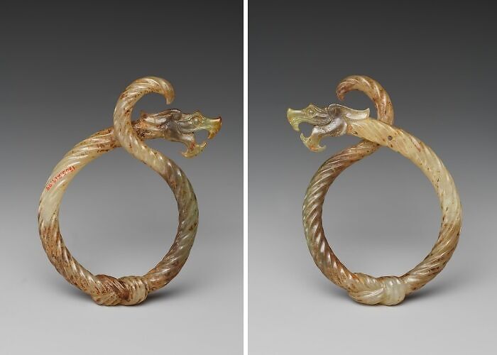 Jade bracelet shaped like a dragon with detailed carving