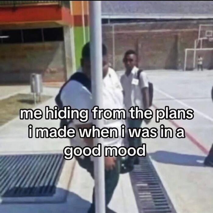 Female meme of person hiding behind pole to avoid plans made in good mood