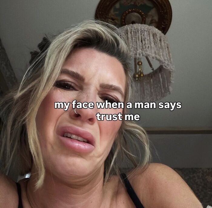 Woman making disgusted face with text about trust, relatable female memes