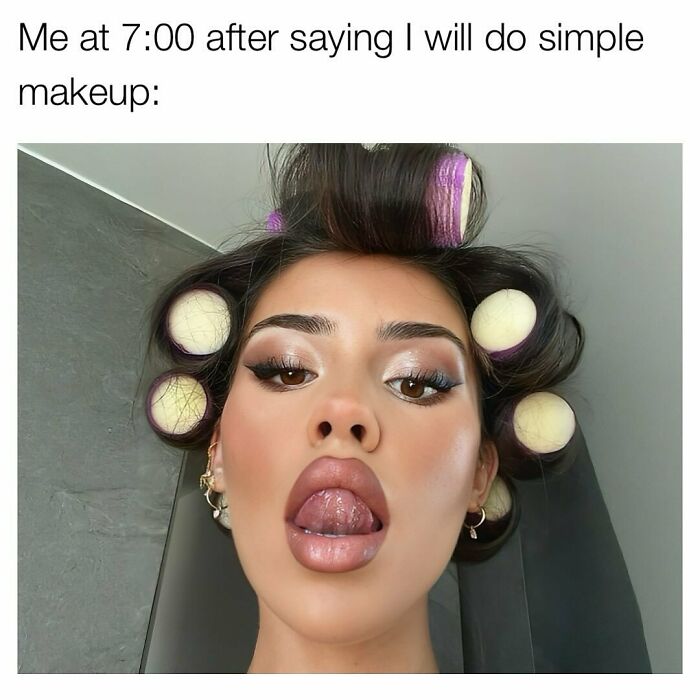 Woman wearing hair rollers with full glamorous makeup for relatable female memes about beauty routines