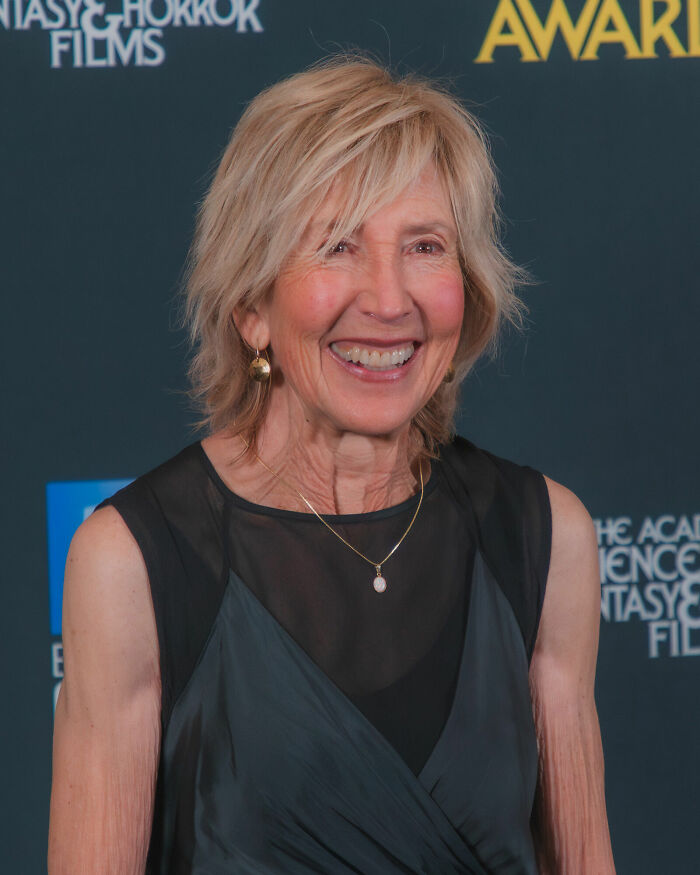 Actress Lin Shaye smiling on the red carpet, highlighting her successful film career