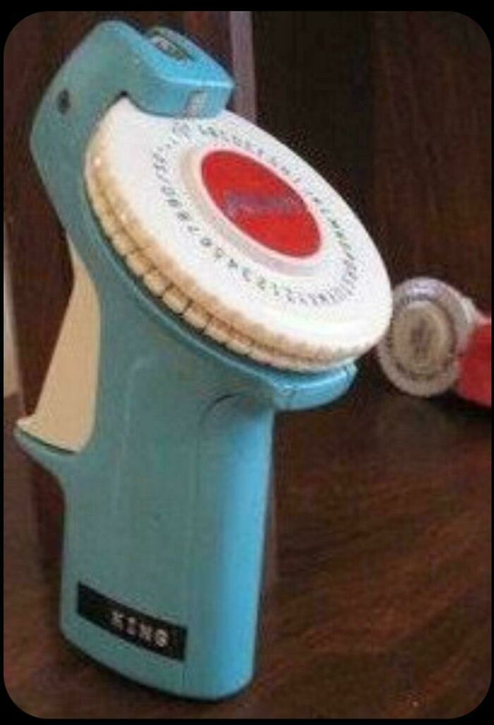 Vintage handheld label maker with rotary dial from nostalgic old days