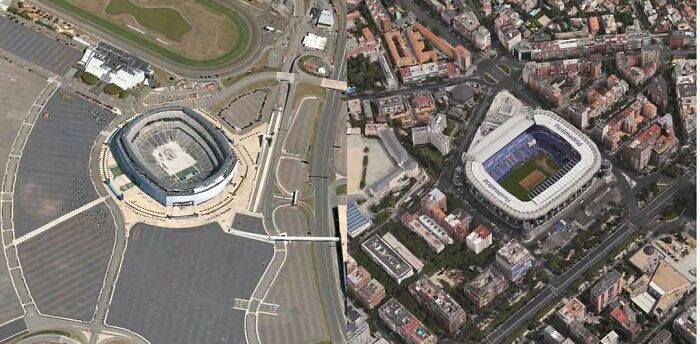 Aerial view of two stadiums highlighting unusual construction layout