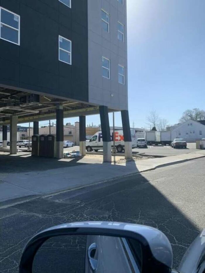Building supported by tilted and unstable-looking supports posing a construction fail