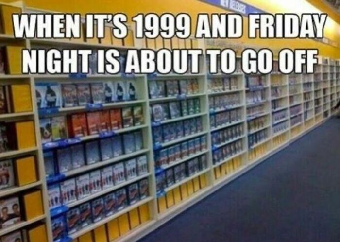 Nostalgic image of fully stocked VHS shelves at Blockbuster video store in 1999