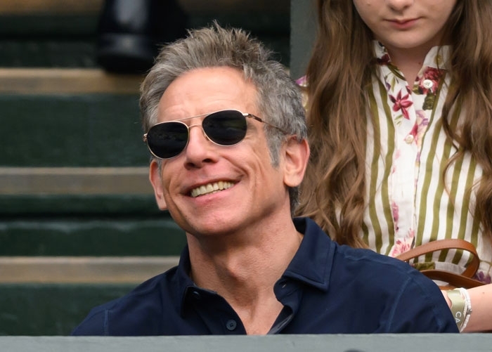 Actor Ben Stiller wearing sunglasses and smiling outdoors. Actor Ben Stiller wearing sunglasses and smiling outdoors.