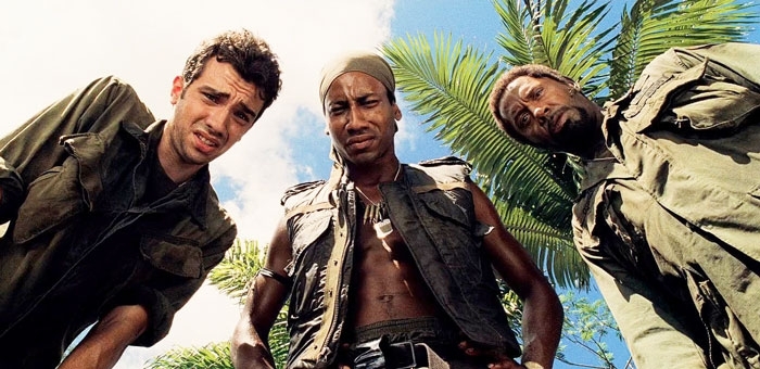 Cast members looking down at the camera in a jungle scene from Tropic Thunder. Cast members looking down at the camera in a jungle scene from Tropic Thunder.