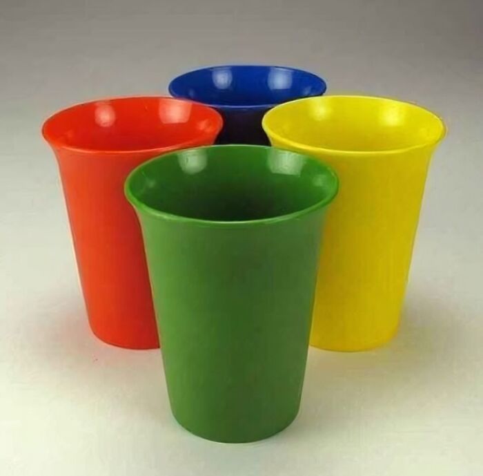 Colorful vintage plastic drinking cups in red green blue and yellow