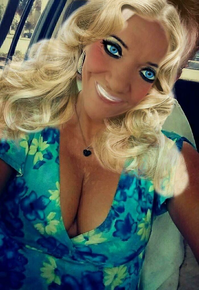 Ridiculously edited photo of woman with exaggerated facial features and cleavage