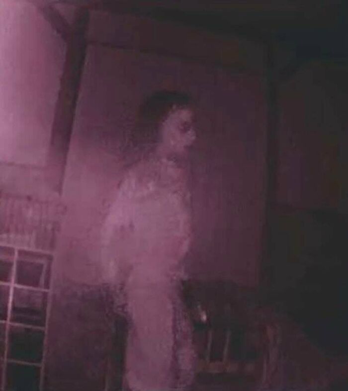 Creepy photos displaying a eerie pale ghostlike figure wearing a dress standing in a dark room.