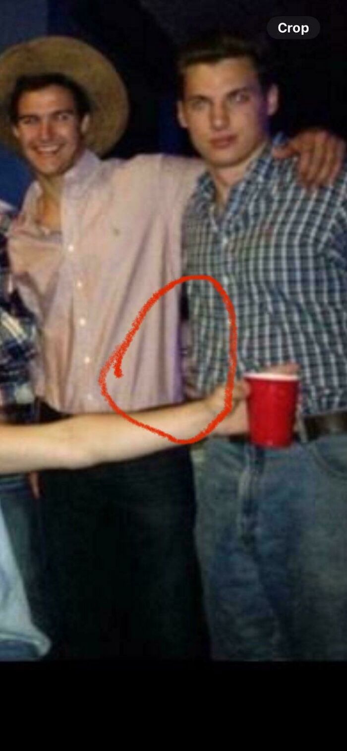 Creepy photos show an extra mystery arm reaching out to hold a red cup at a party