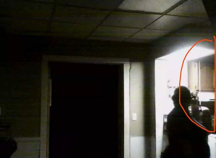Eerie shadowed silhouette in dark kitchen highlighted in creepy photos.