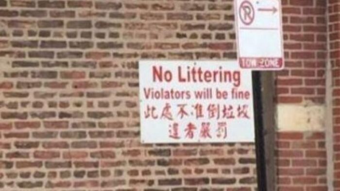 No littering sign with a funny translation fail reading violators will be fine