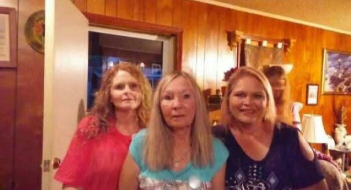 Creepy photos of three women indoors with a strange shadowy figure in the doorway behind them.