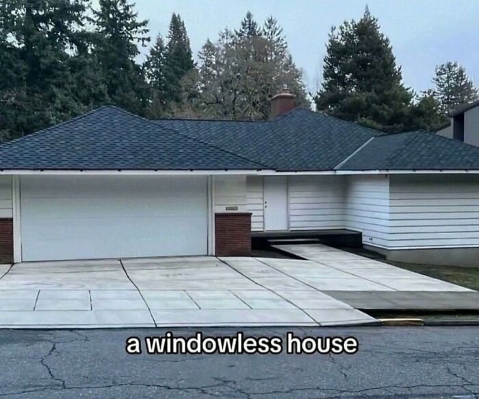 A suburban house with no windows, presenting cursed images of eerie architecture.