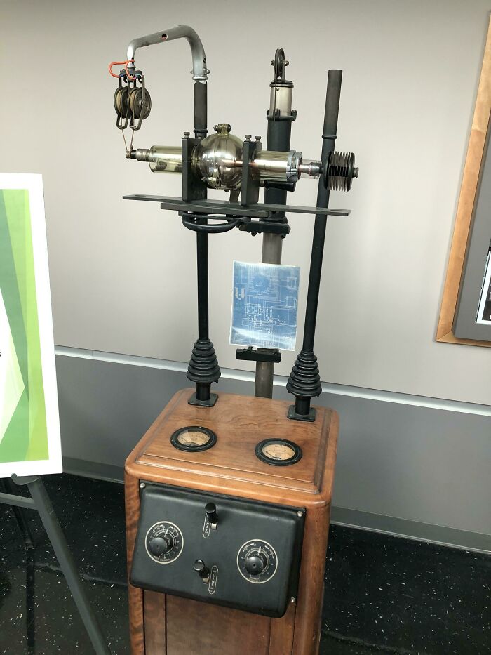 Old scientific apparatus with dials and glass components from historical device