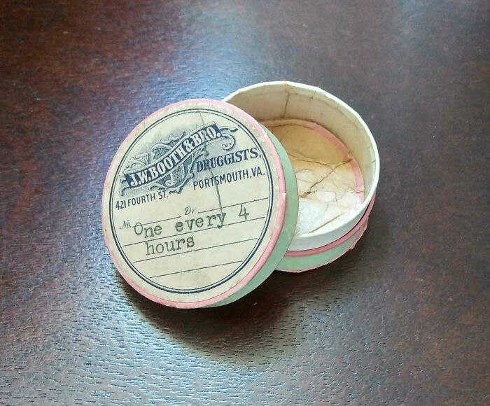 Antique circular druggist pillbox labeled for medication every four hours