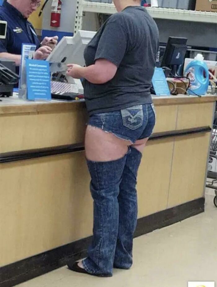 Woman wearing shorts and detached denim leggings at Walmart checkout