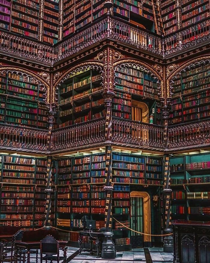 Historical photo of an ornate library interior filled with books