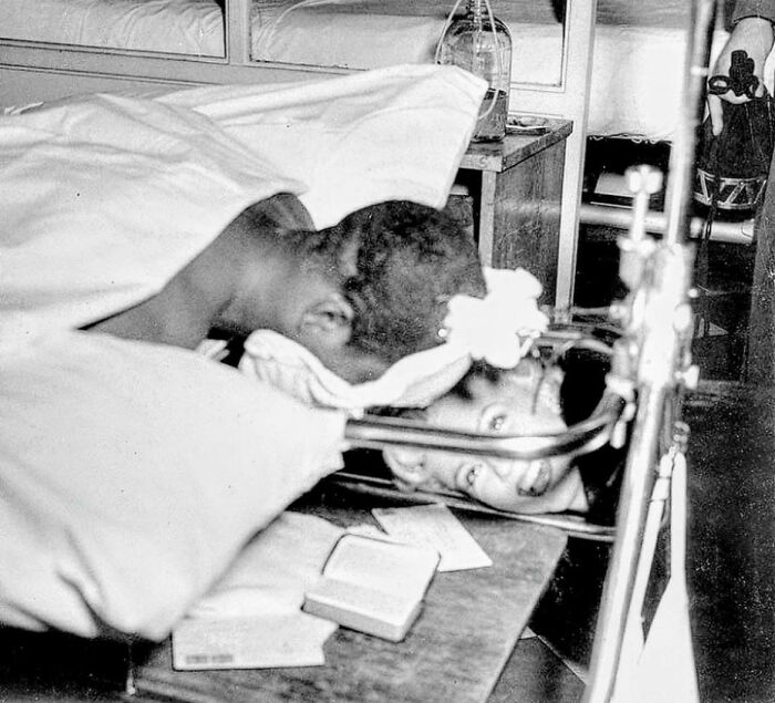 Rare historical photo of early dental care procedure with patient and dentist