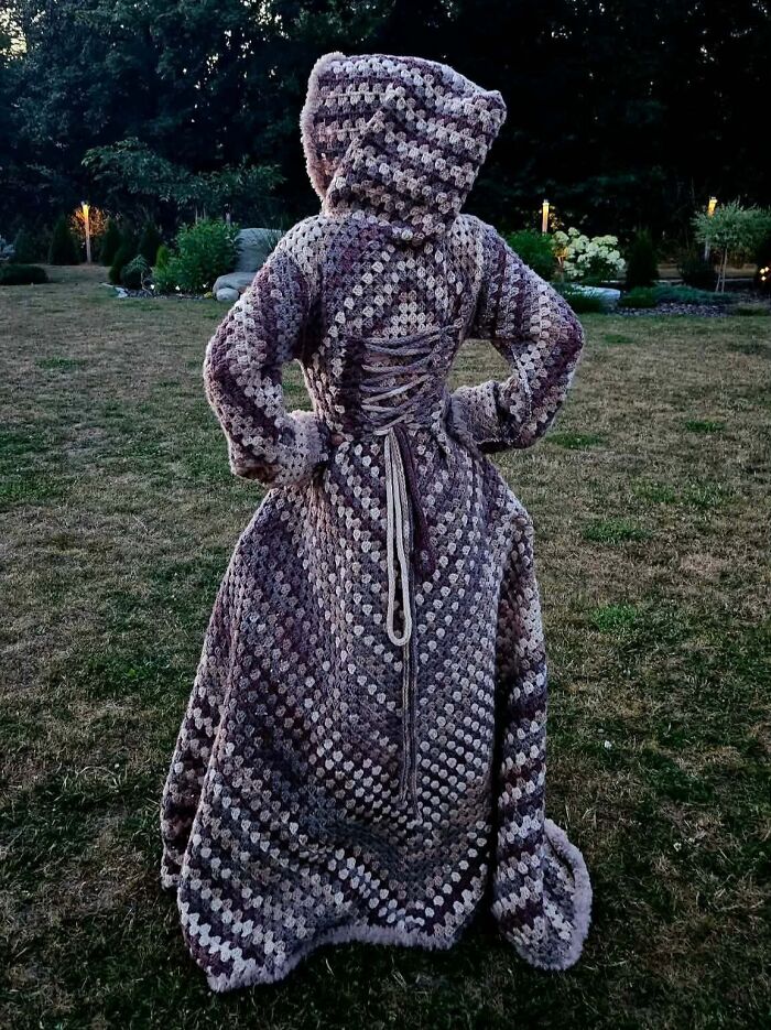 Full-length crochet dress with hood and corset-style back detail in neutral tones