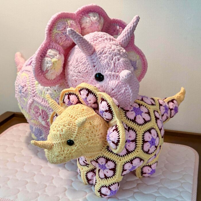 Crochet dinosaur plush toys made with colorful yarn patterns