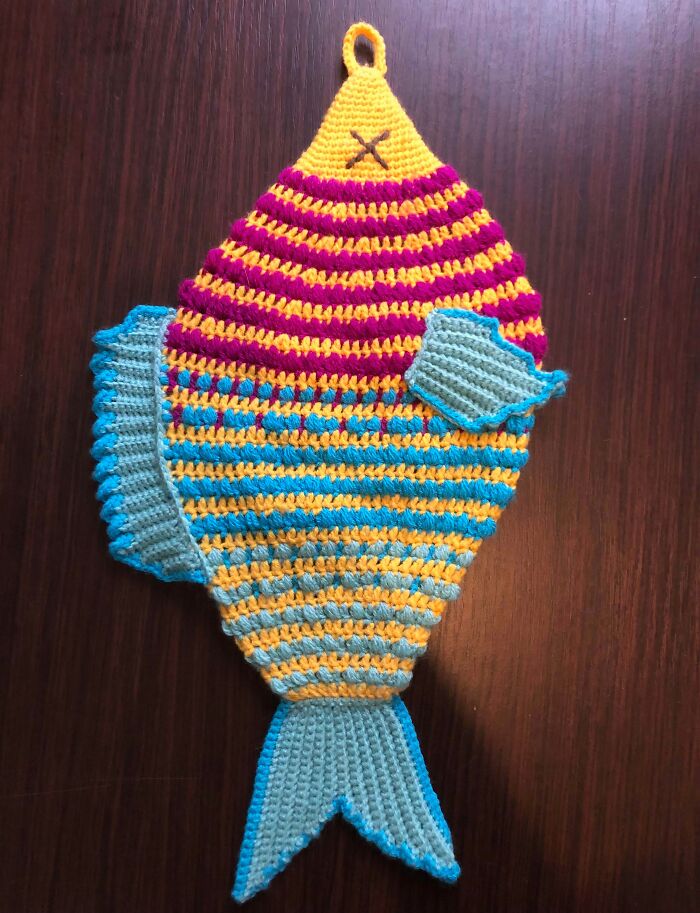 Striped crochet fish with fins and tail in bright colors