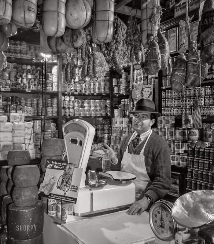 Rare historical photo of butcher shop with hanging meats and vintage scales