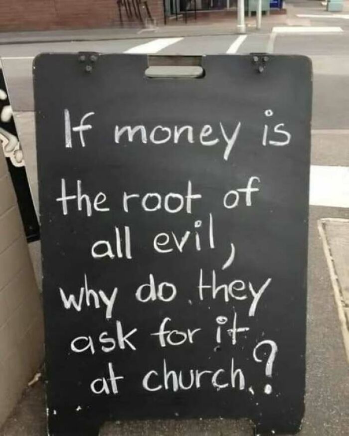 Strange sign on a sidewalk asking a funny question about money and church