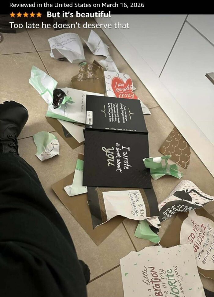 Humorous Amazon review showing torn book and gift wrap with positive rating