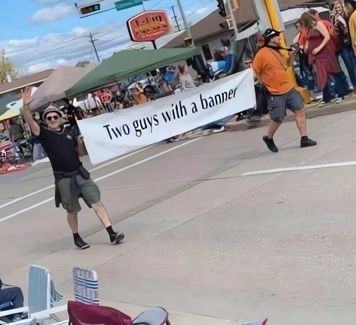 Two men carrying a sign that says Two guys with a banner in amusing posts