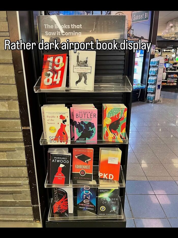 A dark airport bookstore shelf featuring dystopian novels in a set of weird photos