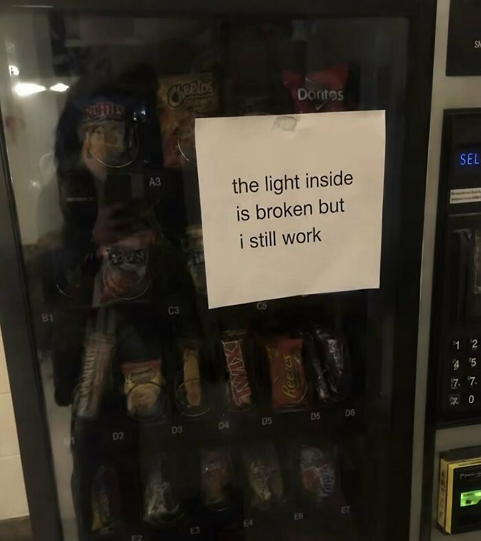 Weird and funny photos of a vending machine with a sign reading the light inside is broken.