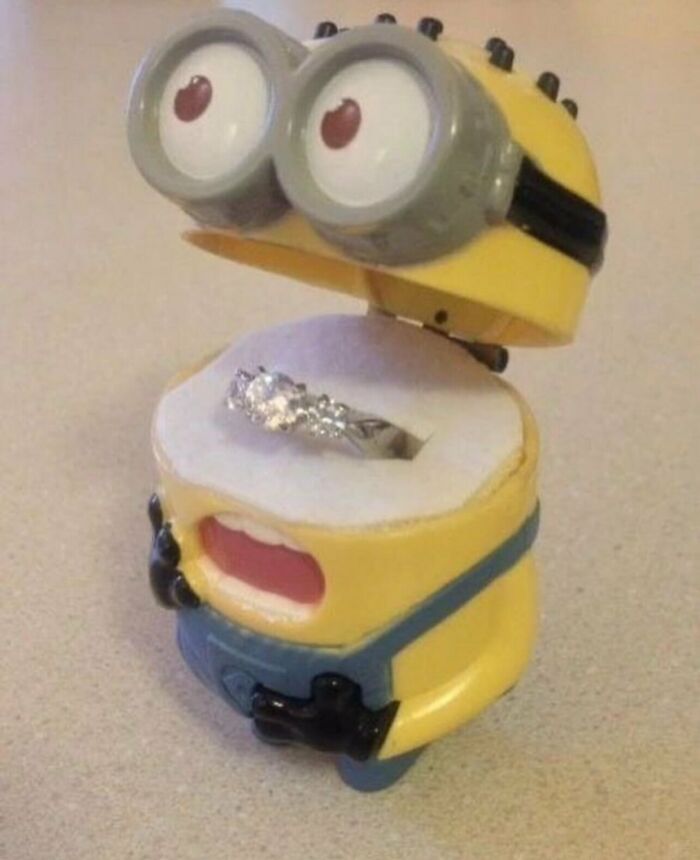 Diamond engagement ring displayed inside a Minion ring box, one of many weird and funny random photos.