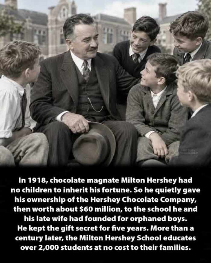 Milton Hershey sitting with school children as part of interesting history moments.