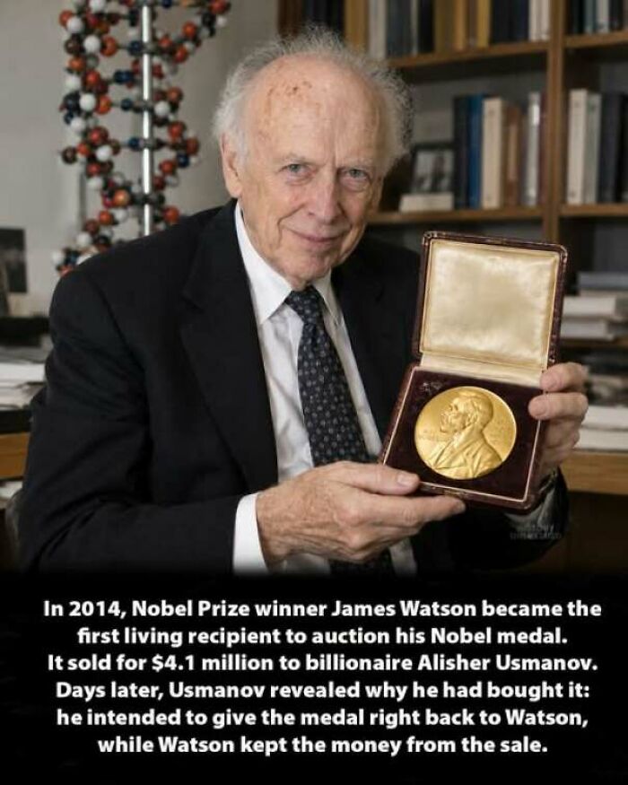 Nobel Prize winner James Watson holding his gold Nobel medal, an interesting history moment.
