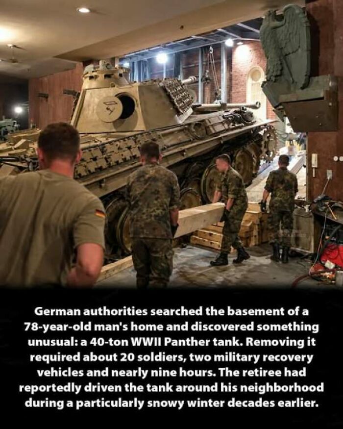 German soldiers moving a WWII Panther tank out of a basement, an interesting history moment.