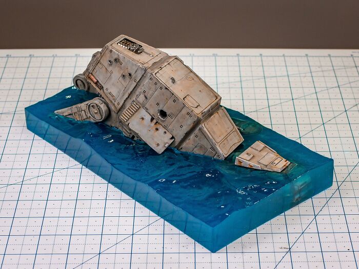 Miniature model of an armored vehicle partially submerged in resin water