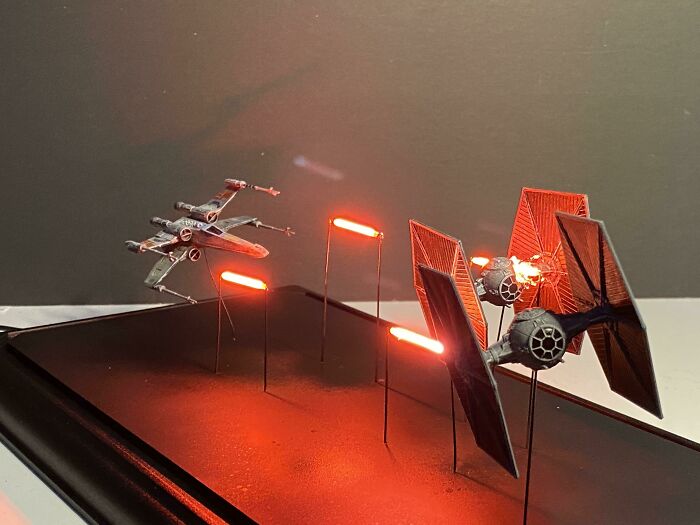 Star Wars miniature models with LED laser effects in a space battle scene