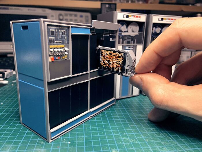 Miniature vintage computer model with removable detailed part showing craftsmanship