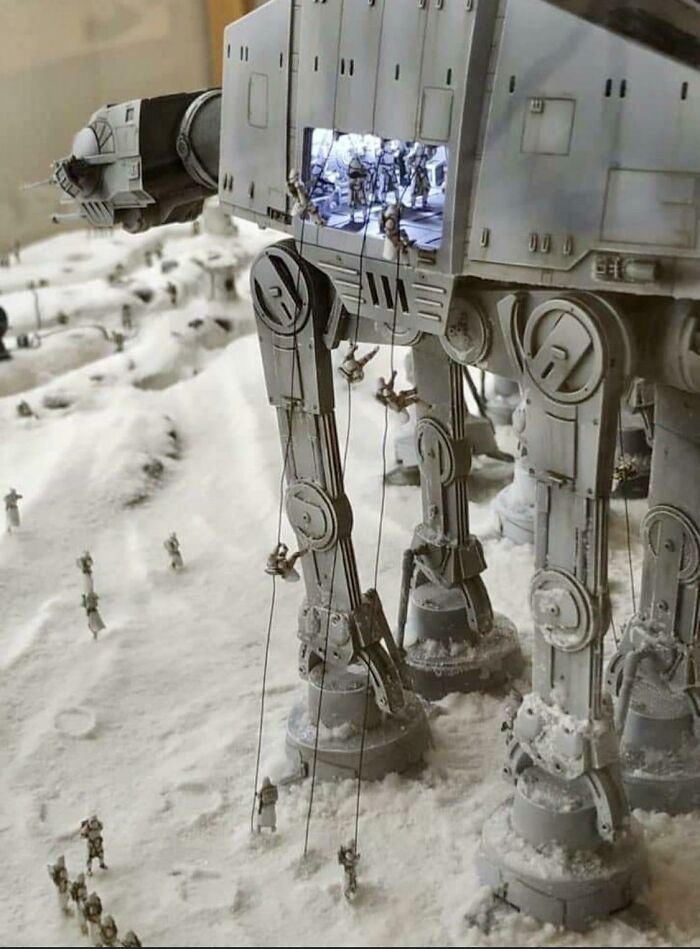 Miniature Star Wars AT-AT model with climbers and snow scene showing detailed craftsmanship