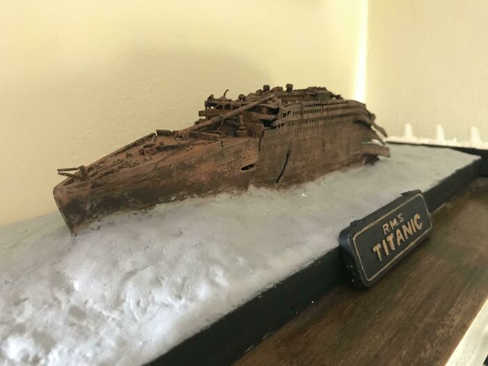 Miniature model of RMS Titanic ship in a weathered and detailed display
