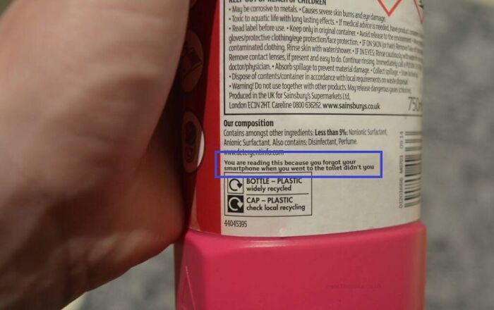Cleaning product bottle with humorous and confusing labels and instructions about forgetting a smartphone.