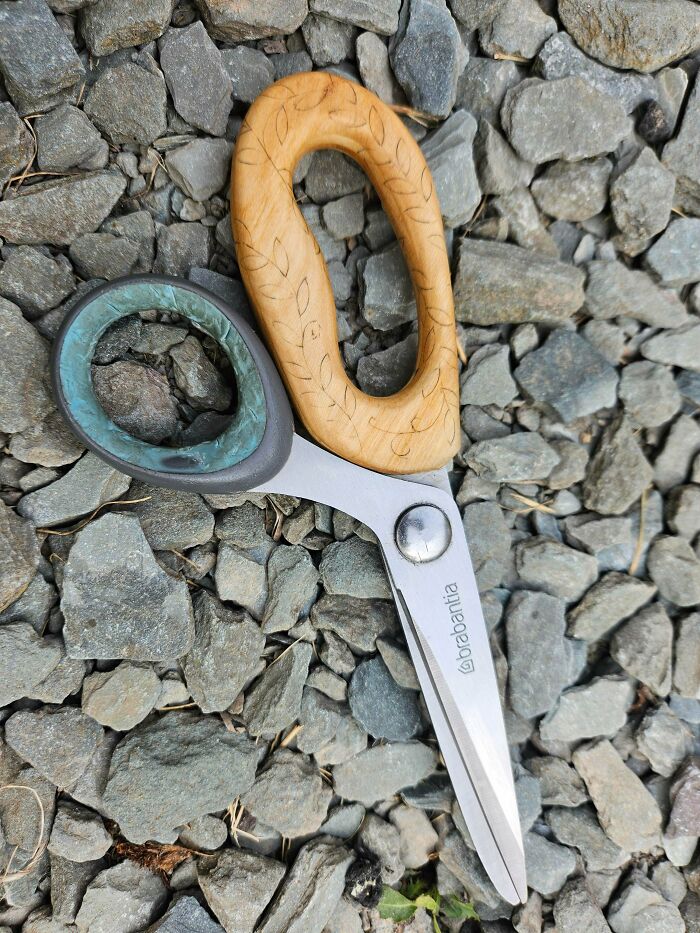 Pair of metal scissors with a custom wooden handle replacement, demonstrating how creativity can save money.
