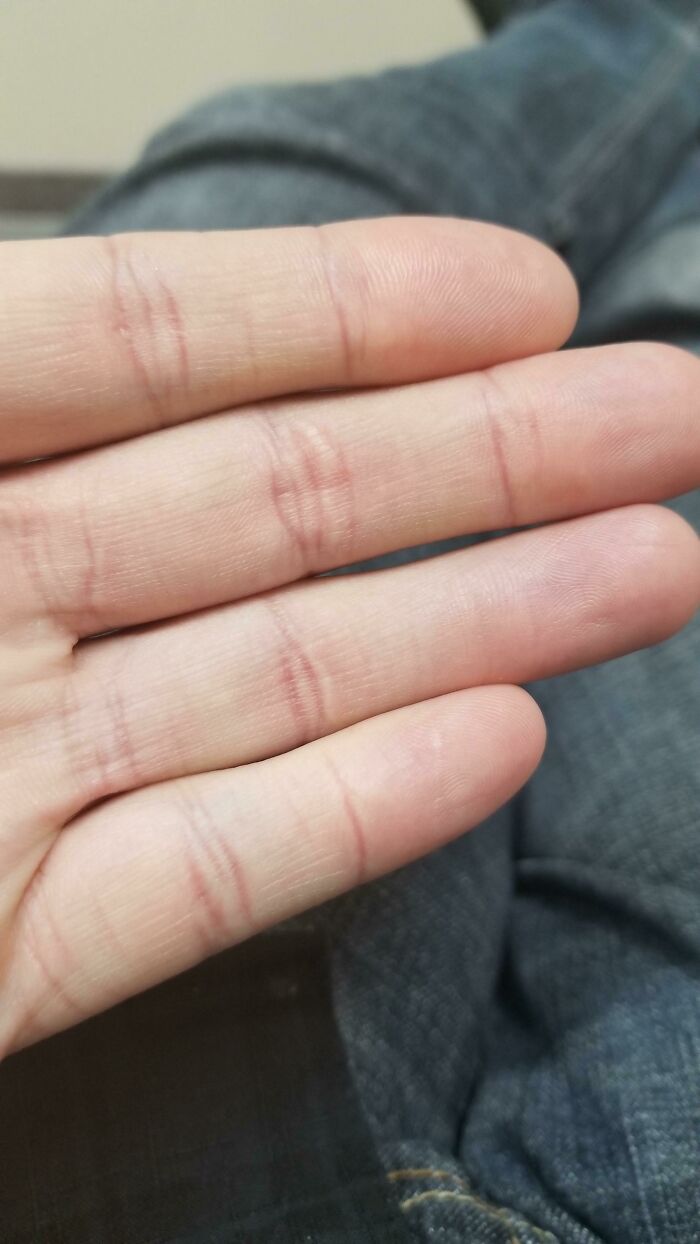 Close-up of fingers with unusual crease glitches